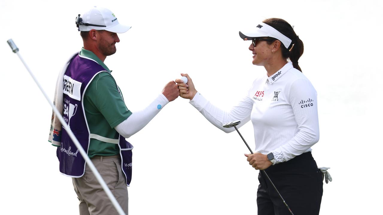 Hannah Green celebrates with her husband and caddie Jarryd Felton.