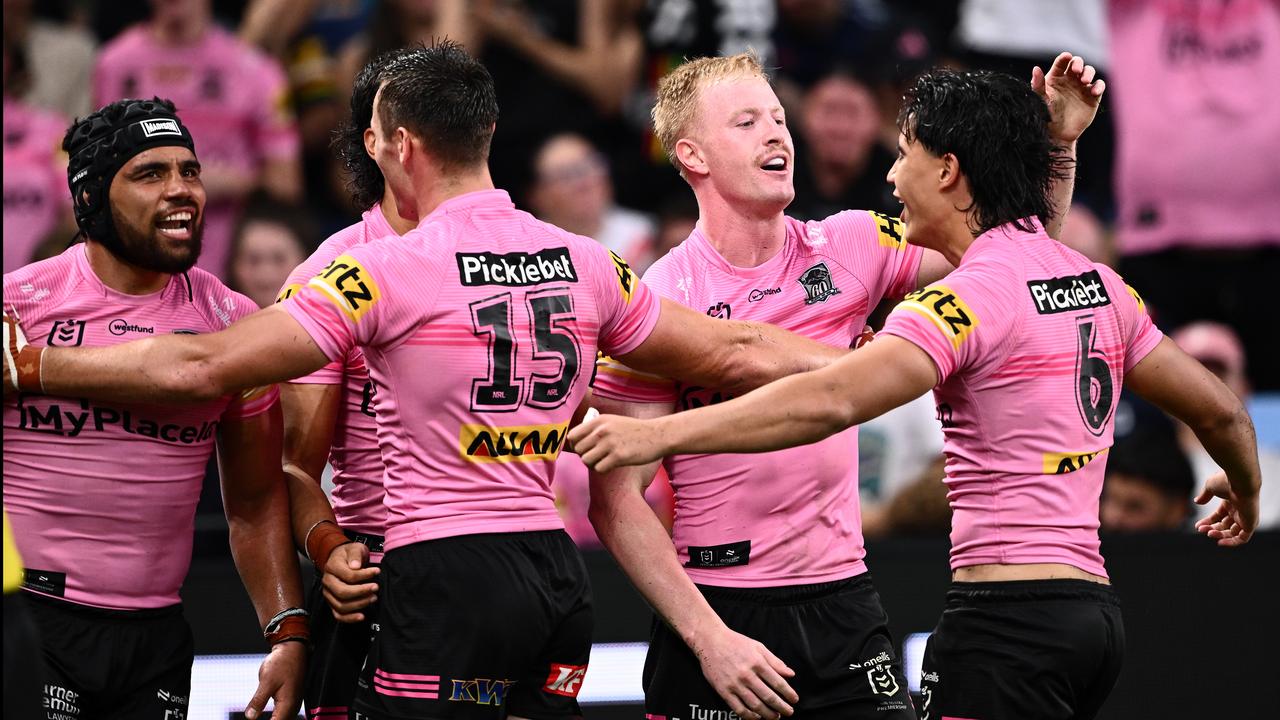 Penrith players celebrate a try.