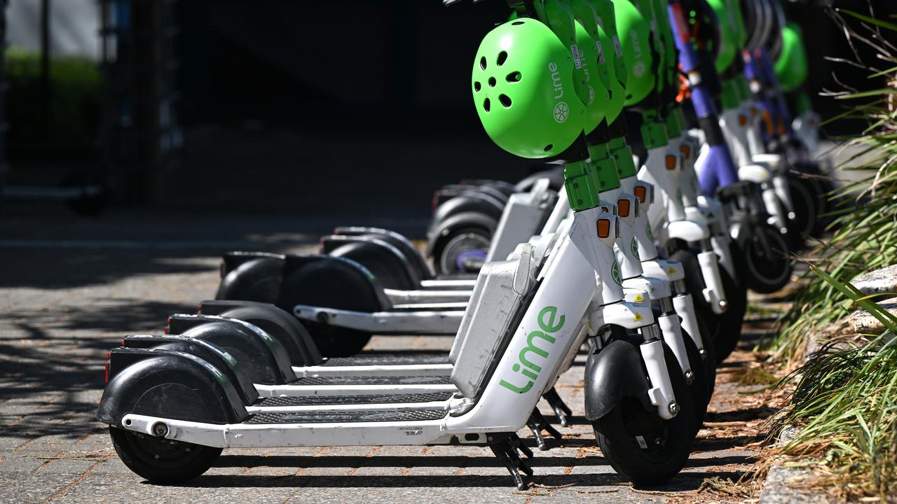 A row of Lime branded E-Scooters