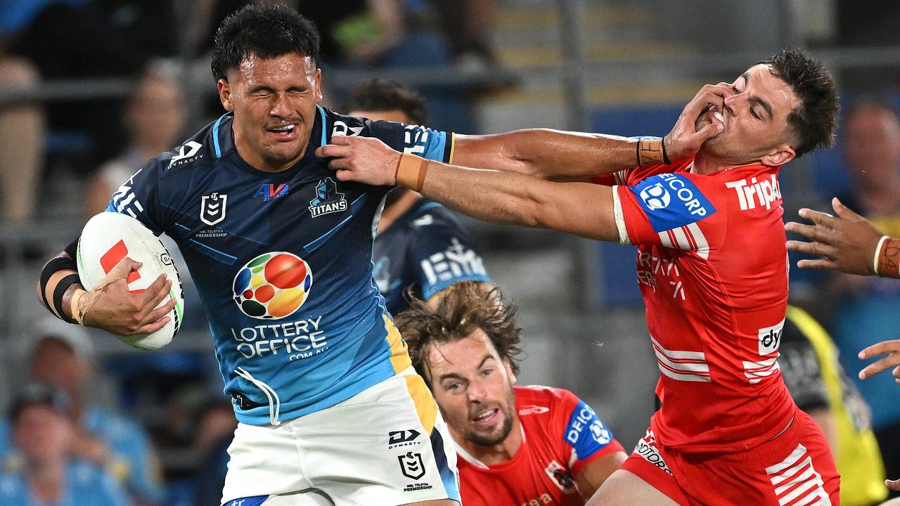 Arama Hau fends off the Dragons' Kyle Flanagan.