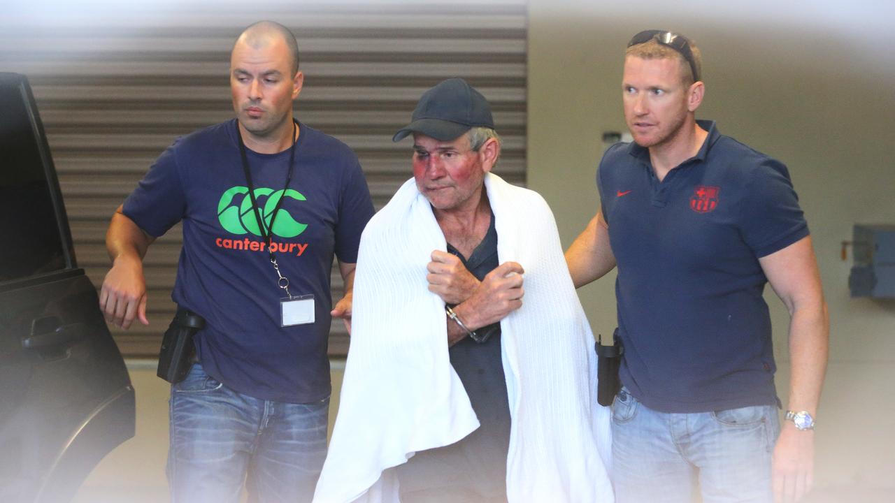 Gino Stocco escorted by two policemen (file image)