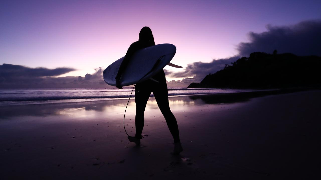 A surfer at sunrise (file image)