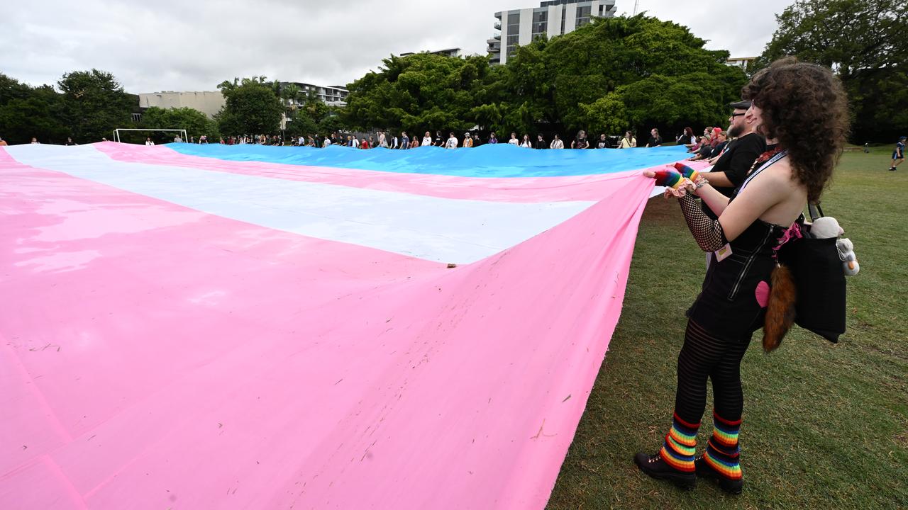 People unfurl the world's largest trans flag