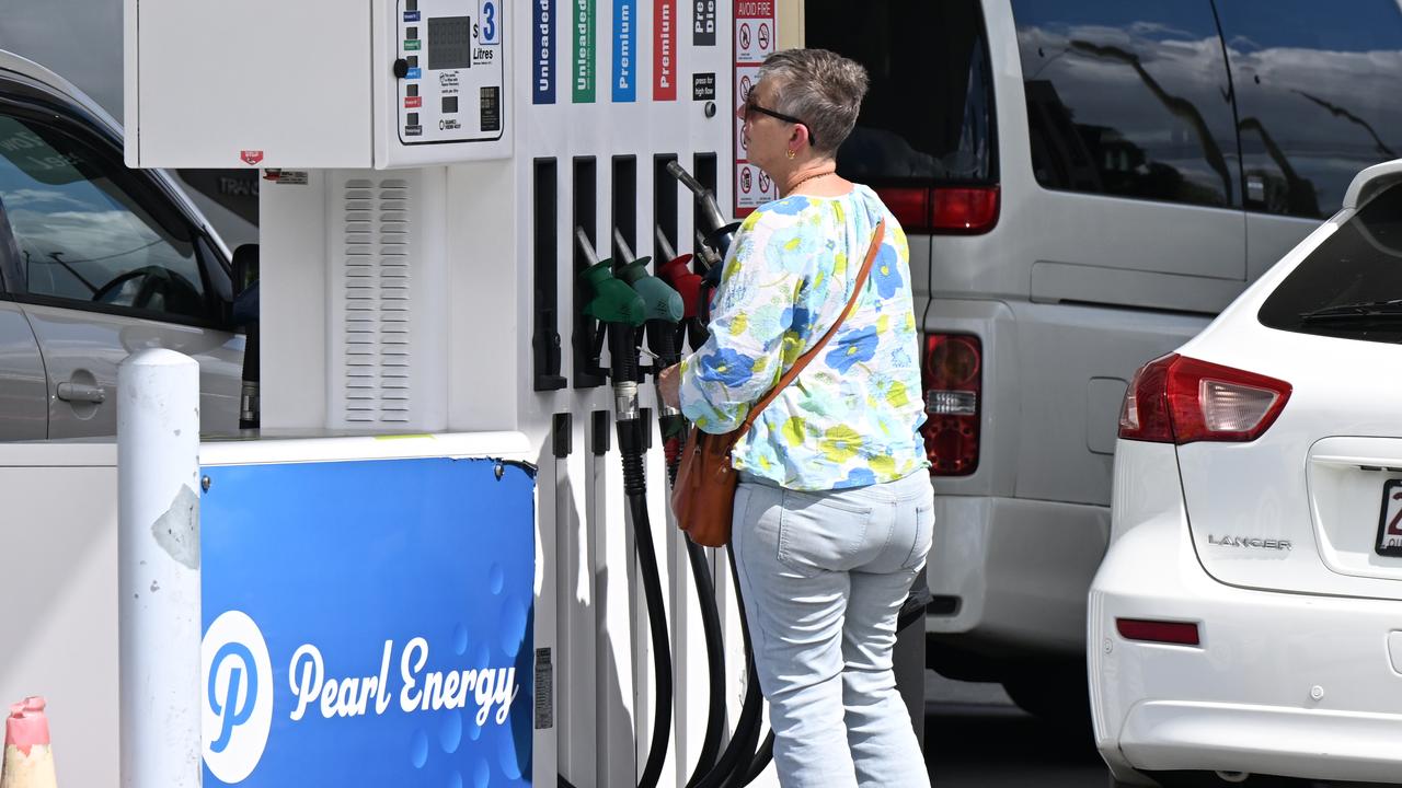 A person filling their car with petrol