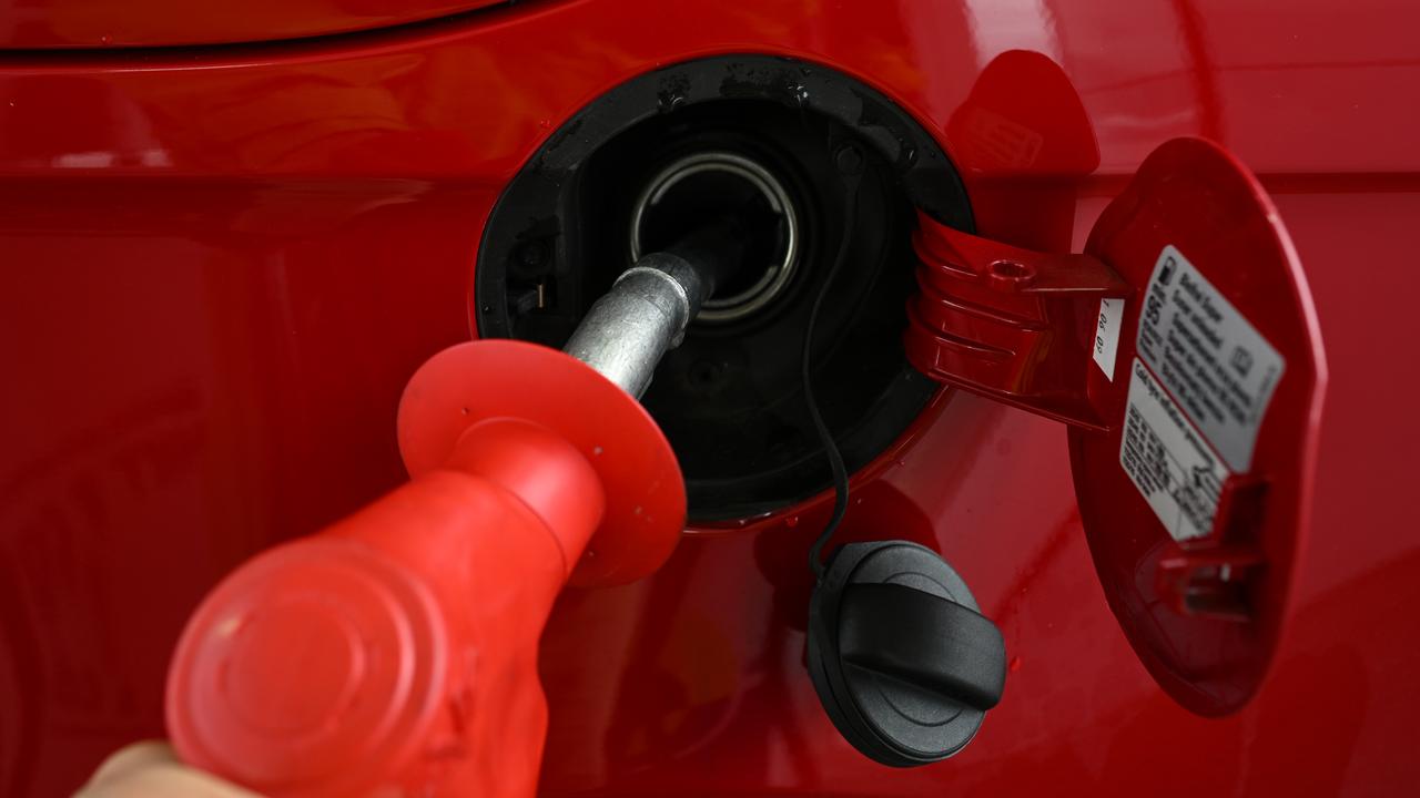 A fuel pump nozzle is used at a petrol station (file image)