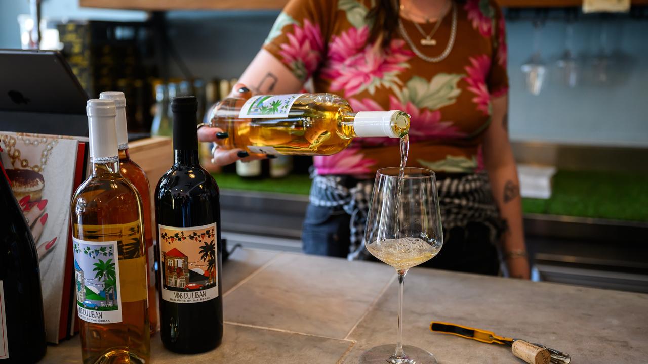 A wine is poured into a glass