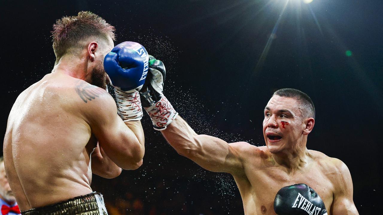 Tim Tszyu throws a punch at Denis Nurja