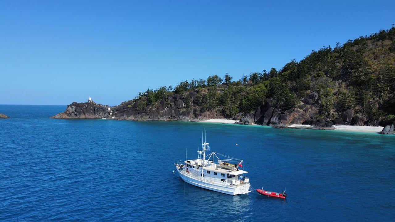 A research vessel sits anchored in the Great Barrier Reef