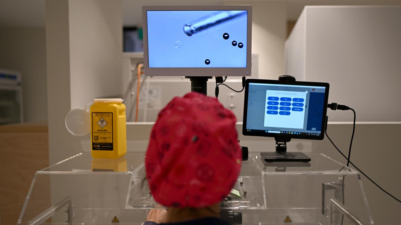 Laboratory technicians at work at an IVF Lab (file)