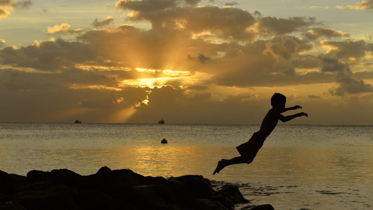 A child jumps into a lagoon in Tuvalu (file image)