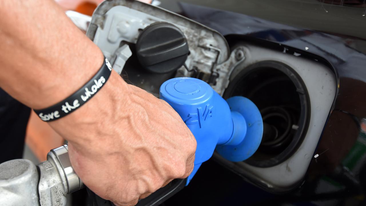 A motorist refuels his car