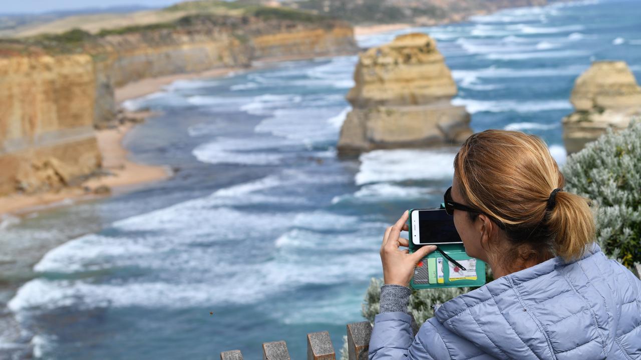A person photographs the Twelve Apostles (file image)