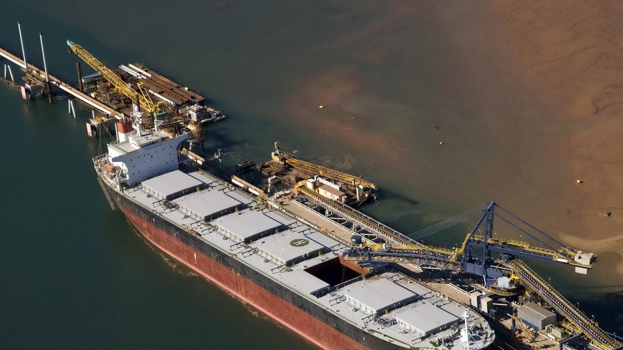Iron ore being loaded onto a ship bound for China in Port Hedland, WA