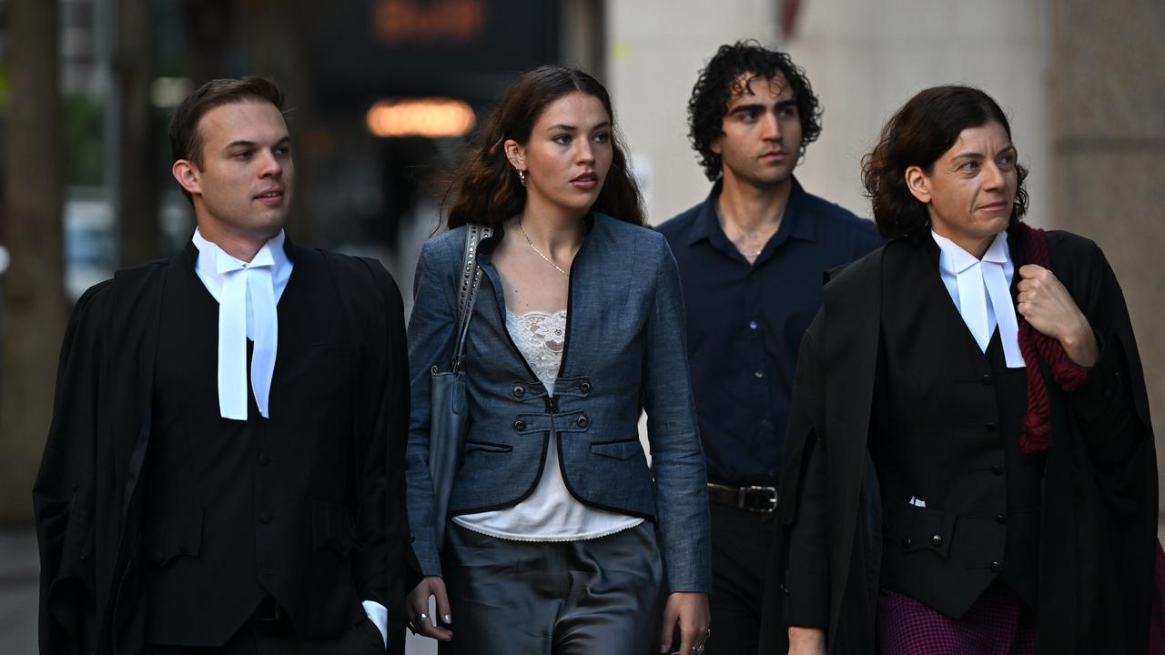 Charlotte Macinnes (centre) arrive at the Federal Court