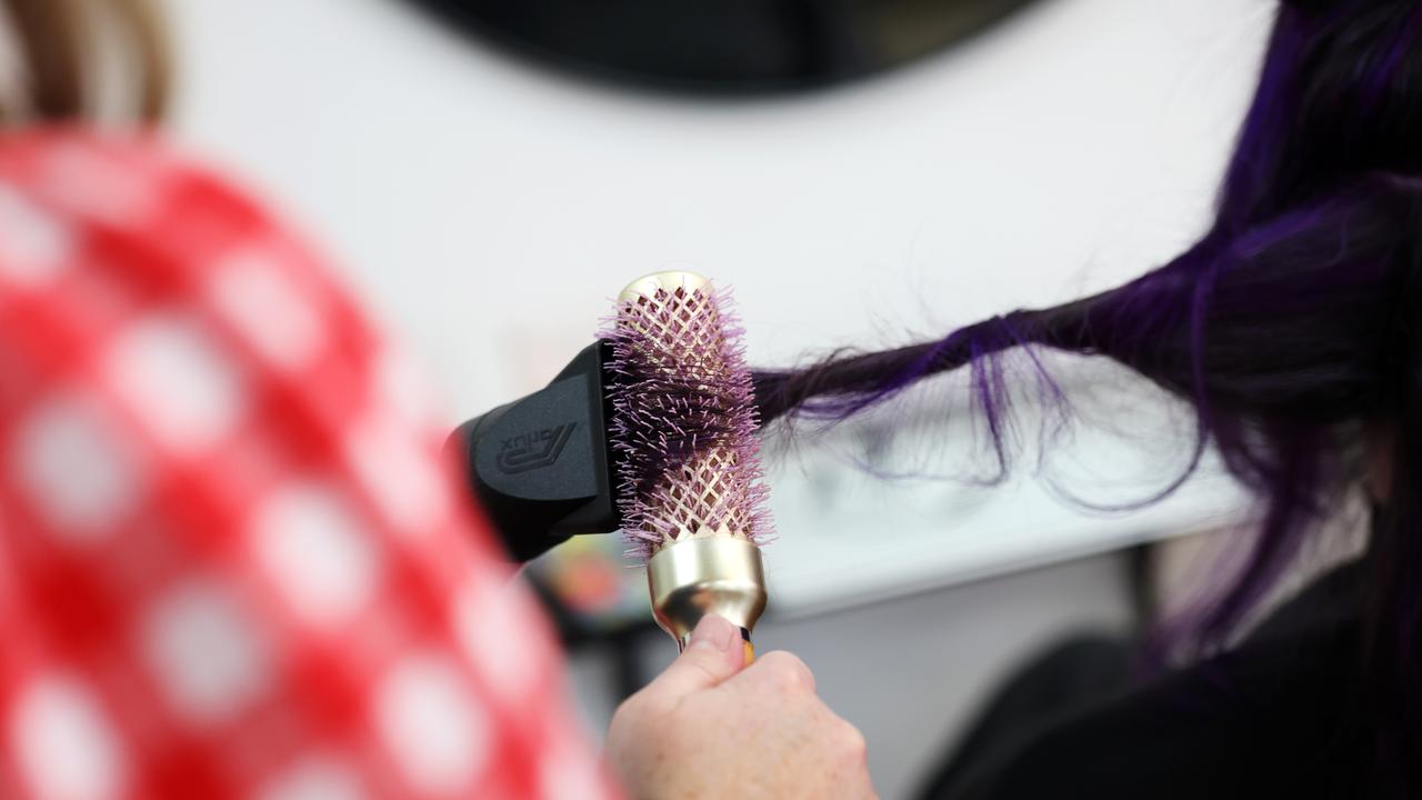 Women brushes hair