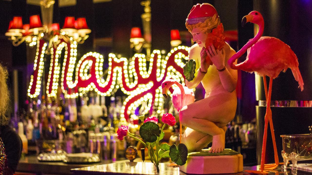 Bar at Mary's with statue and flamingo