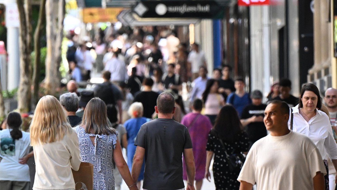 People are seen in the Queen Street Mall in Brisbane
