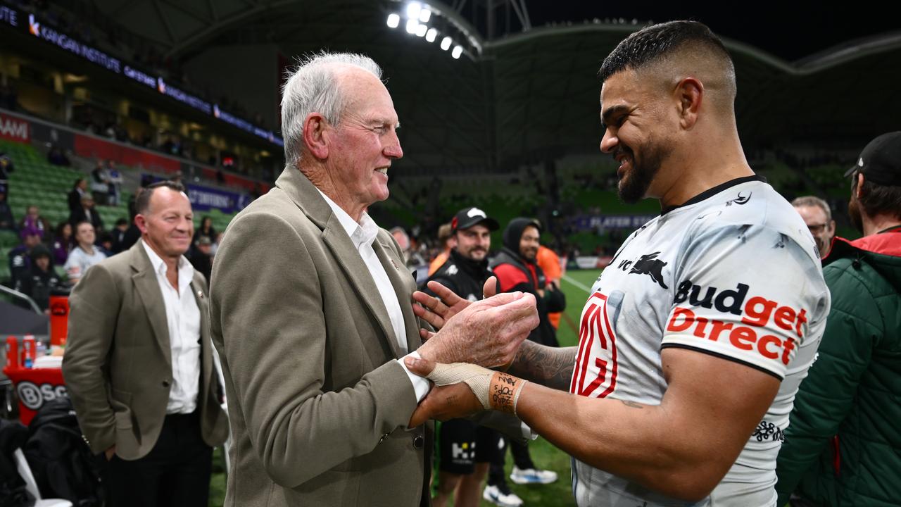 Rabbitohs coach Wayne Bennett celebrates with Latrell Mitchell