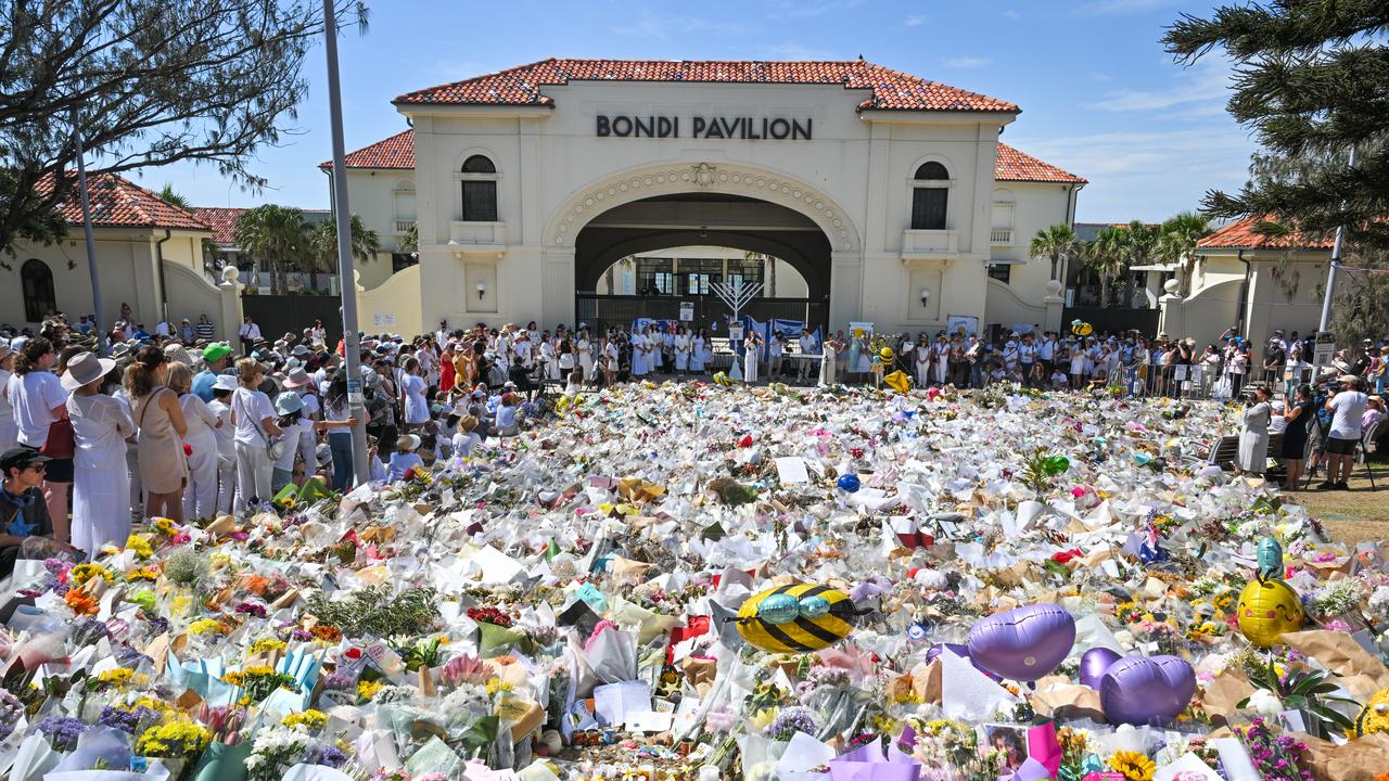 Mourners and flowers are seen at the Bondi Pavillion in Sydney