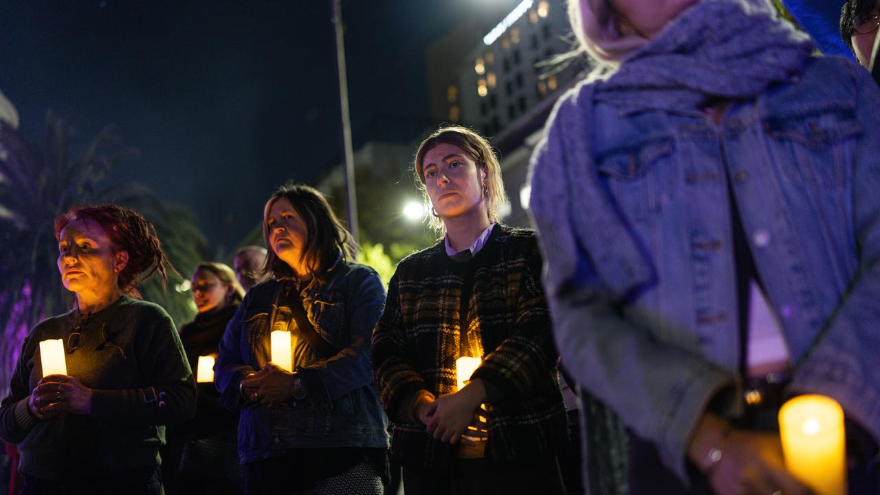People gather during the Safe Steps Candlelight Vigil in Melbourne
