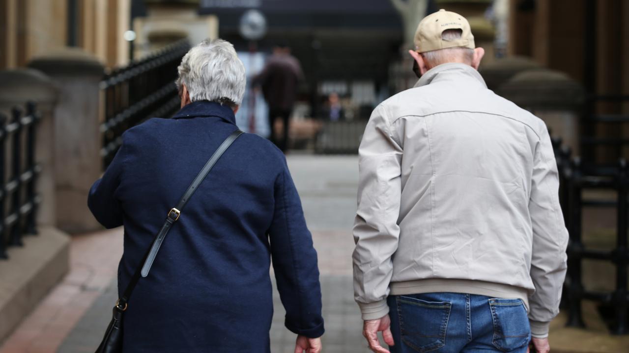 Elderly people walk down a street in Sydney