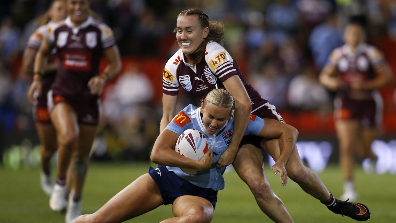 Jaime Chapman tackled by Tamika Upton.