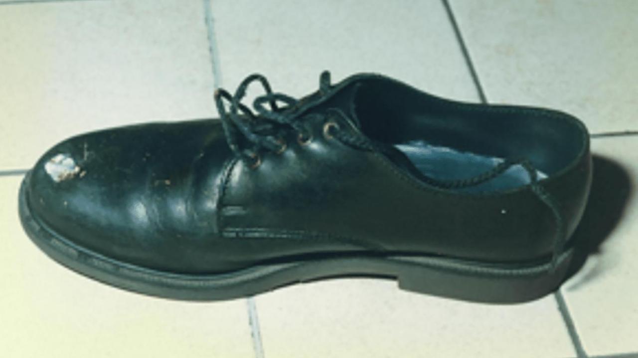 A shoe with a bullet hole