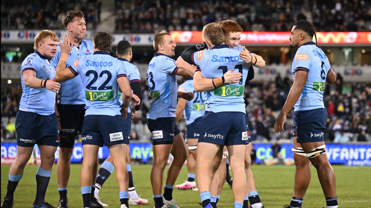 NSW players celebrating.